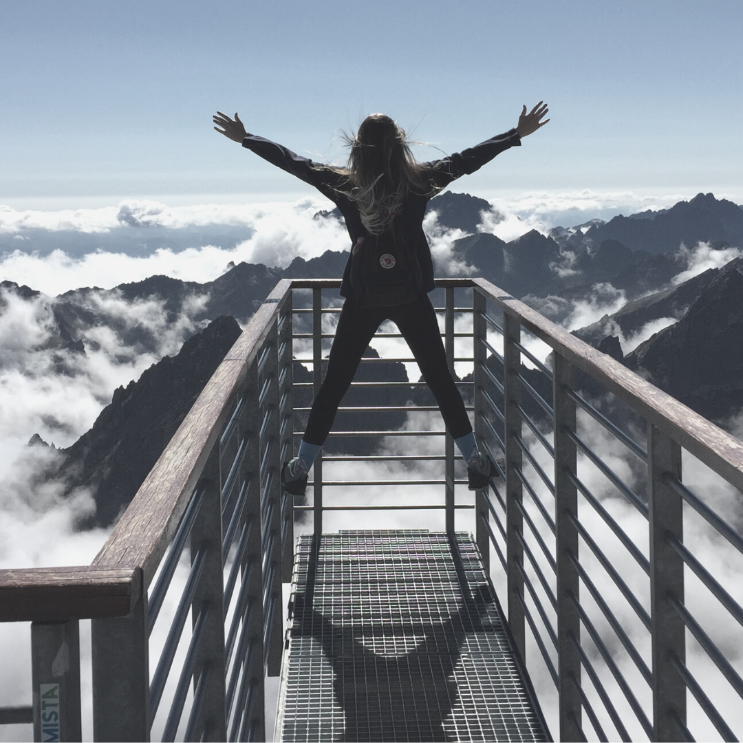 Woman looking over mountains