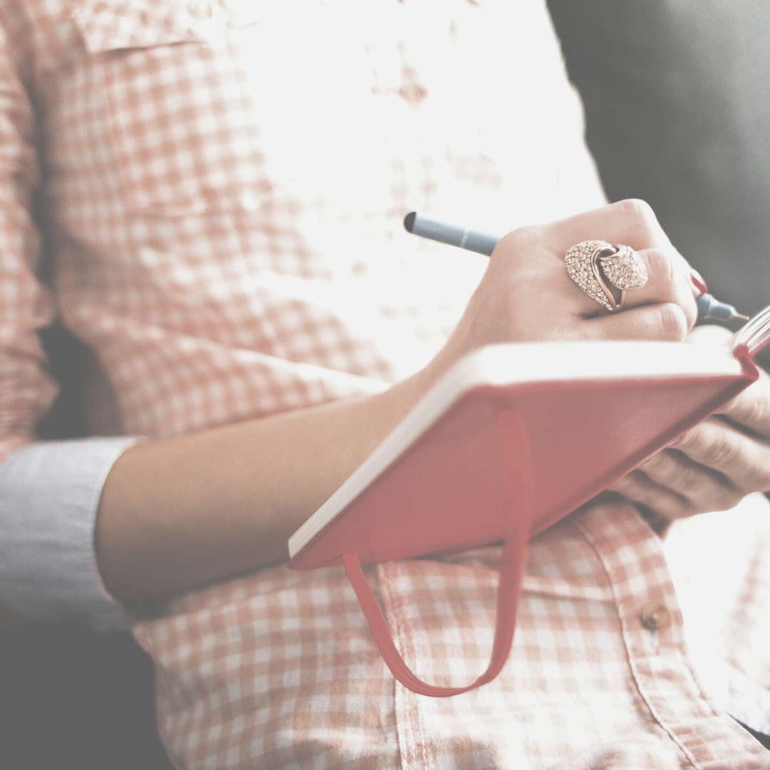 Woman writing in journal